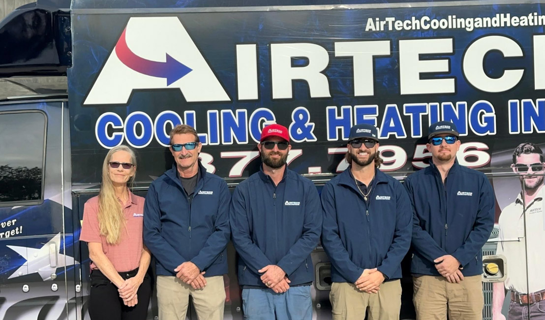 Airtech team standing by their company van